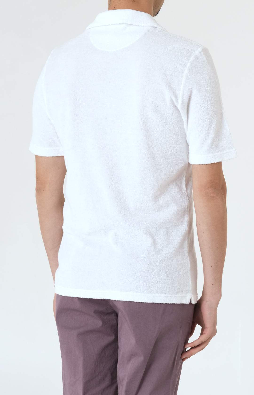 Short-sleeved terry polo shirt with open neck