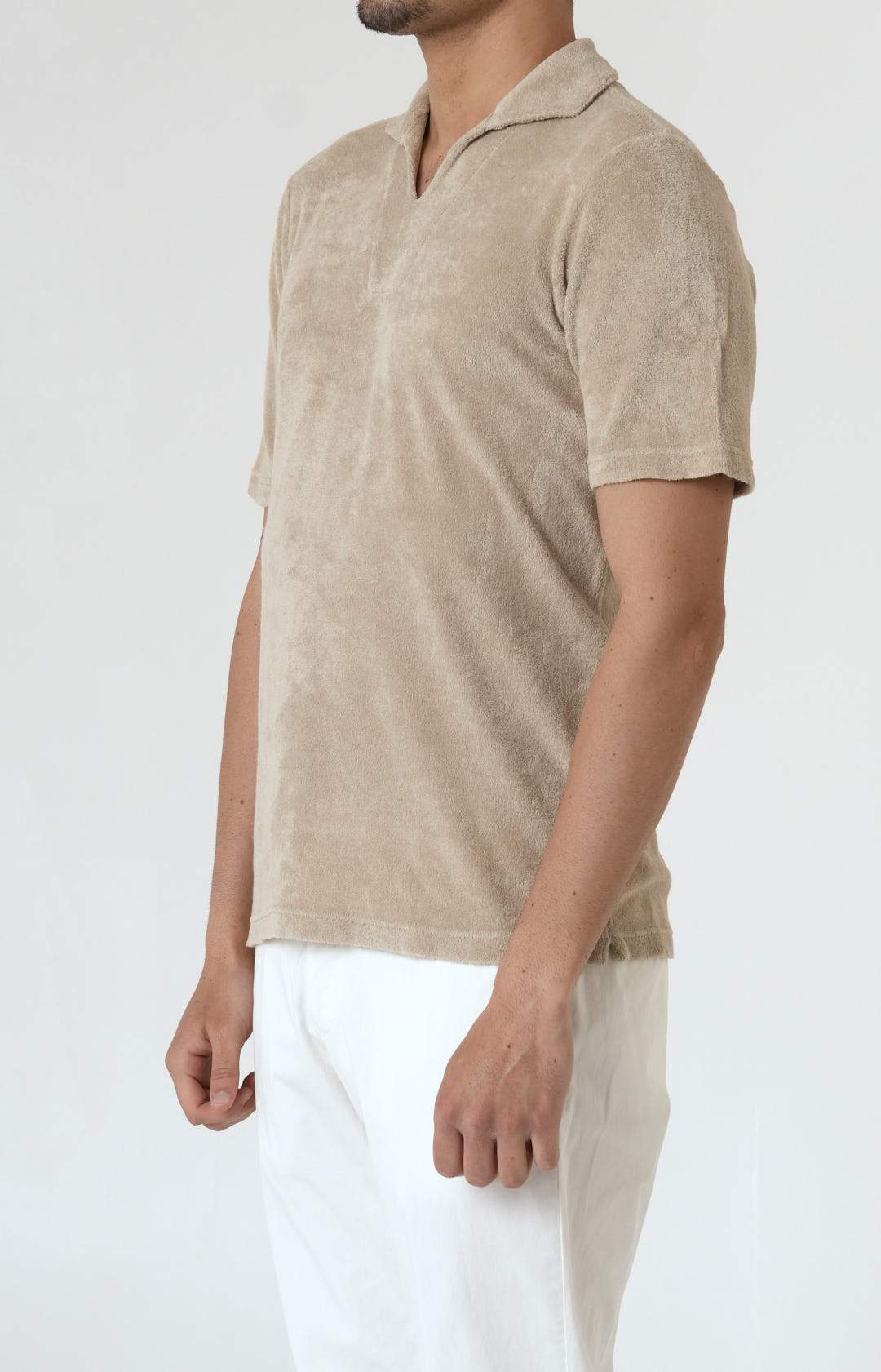 Short-sleeved terry polo shirt with open neck