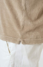 Short-sleeved terry polo shirt with open neck