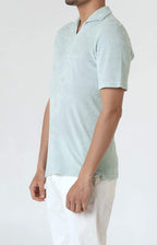 Short-sleeved terry polo shirt with open neck