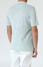 Short-sleeved terry polo shirt with open neck