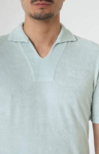 Short-sleeved terry polo shirt with open neck