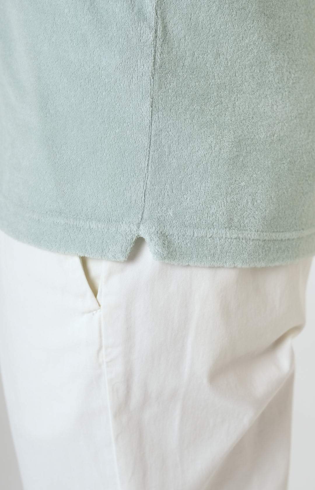Short-sleeved terry polo shirt with open neck